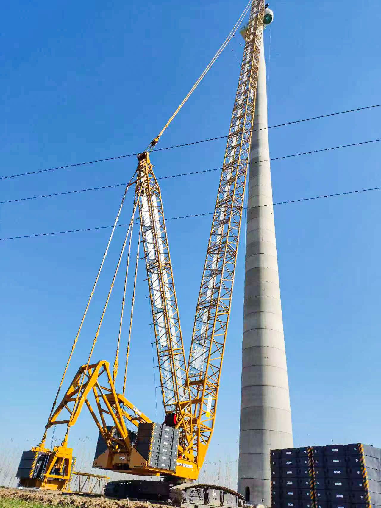 160米高空精准“搭积木”：华体会·官方版网站登录入口XLC15000M分体吊装6.25兆瓦风机全纪录